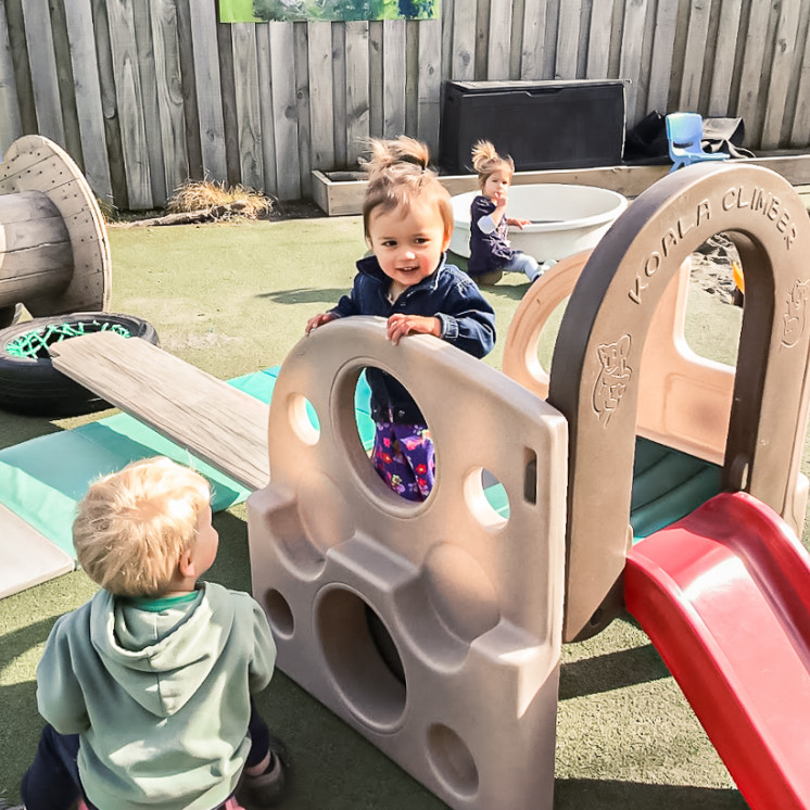 Climbing on the playground at Busy Bees Ashburton 
