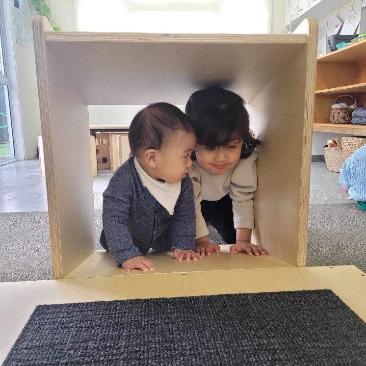 Busy Bees Avonhead kids hiding in a box