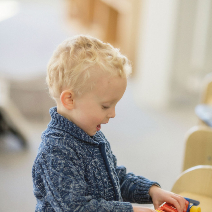 Toddler playing in childcare centre 