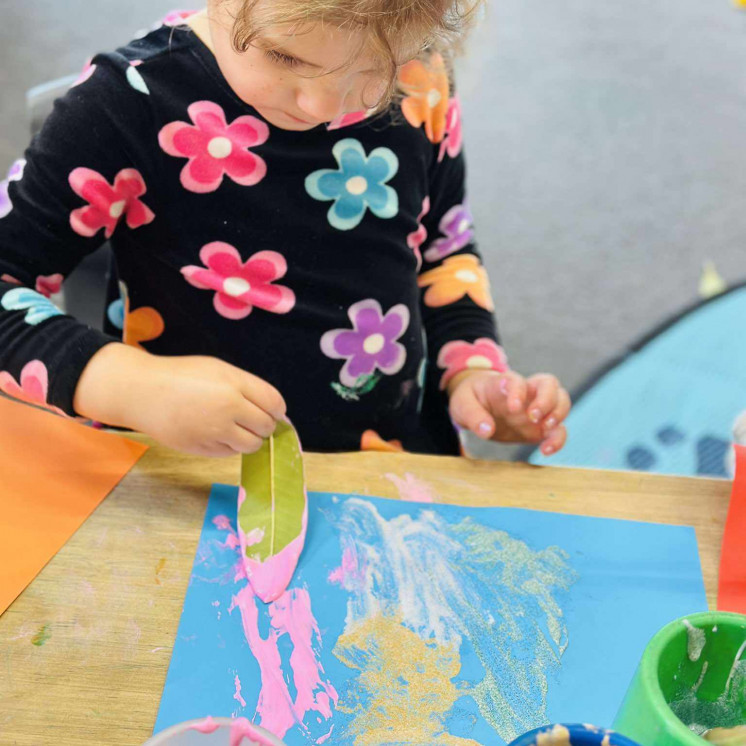 Children love creative expression through paint at Busy Bees Motueka