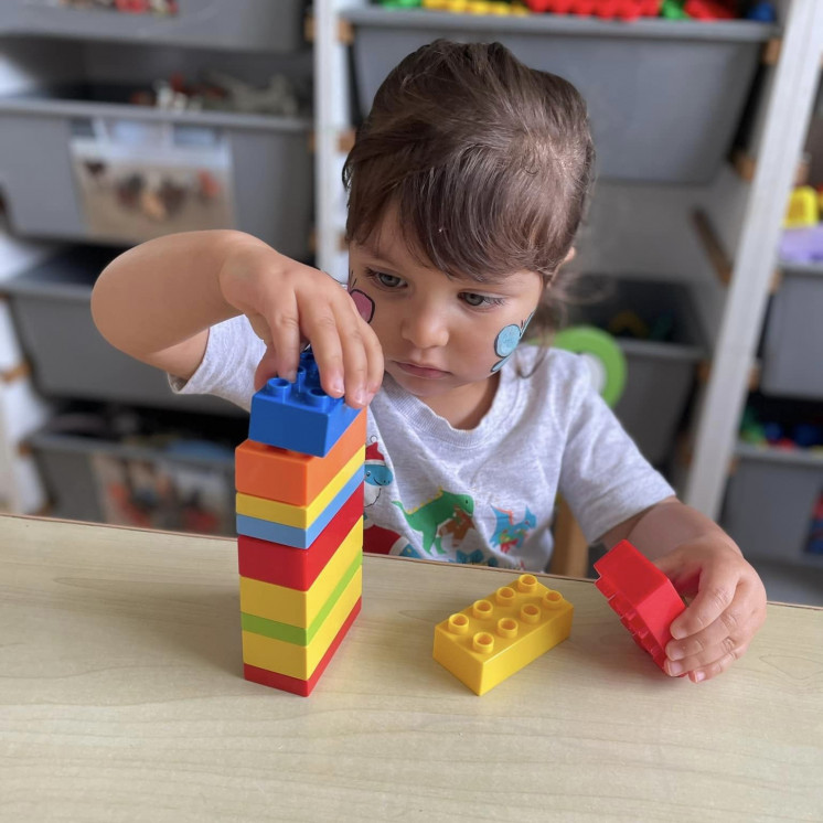Indoor play stacking blocks to build on fine motor skills at Busy Bees Mount Wellington 
