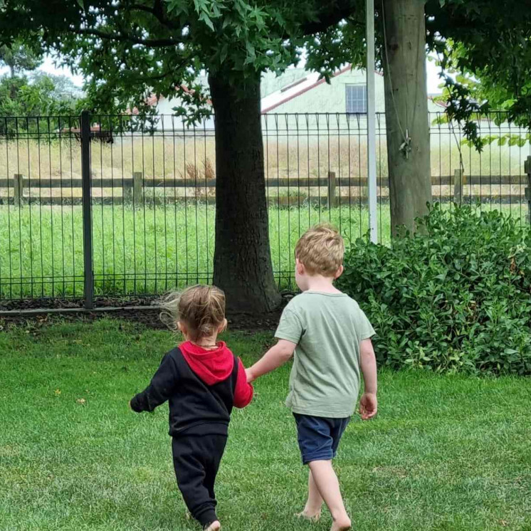 Two friends exploring the outdoors at Busy Bees Napier Road