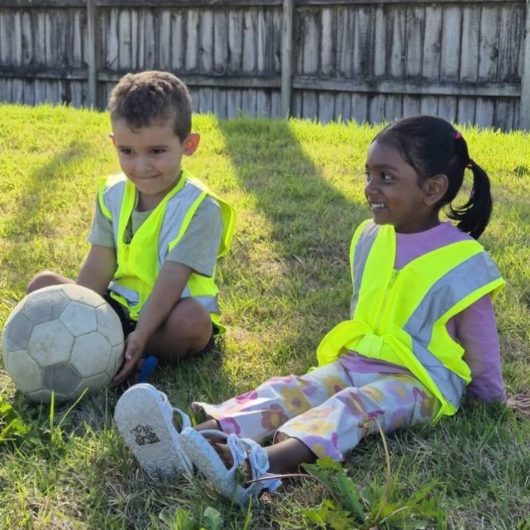Busy Bees Pukekohe outside playing with ball