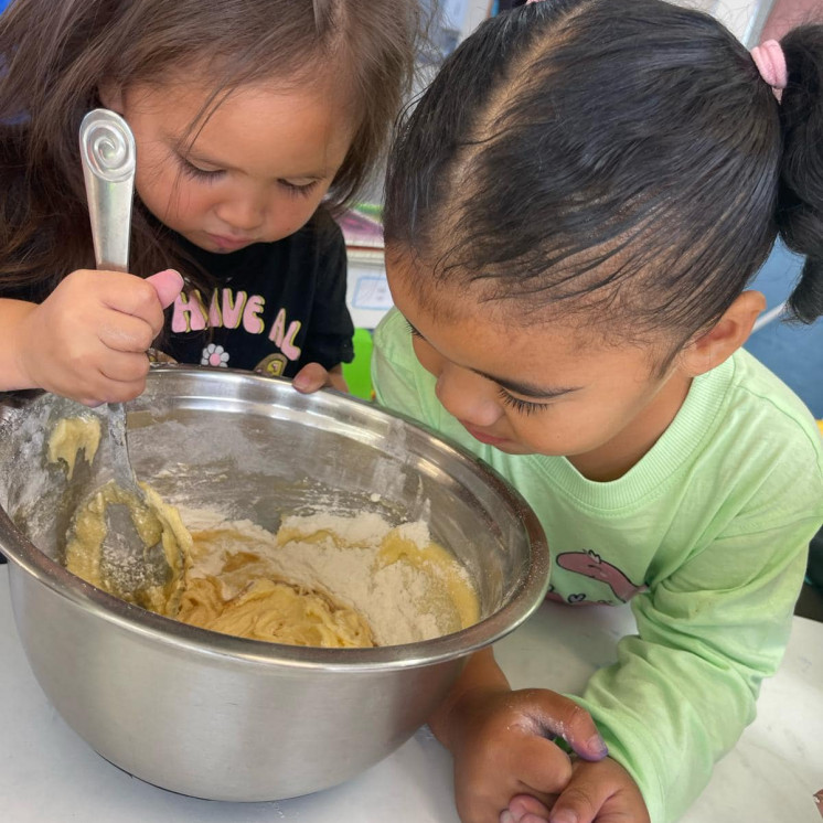 Children at Busy Bees Roscommon Road love to help prepare baking for morning and afternoon tea