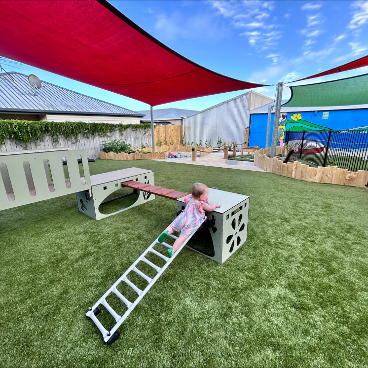 Busy Bees Tahunanui Baby outside on playground 