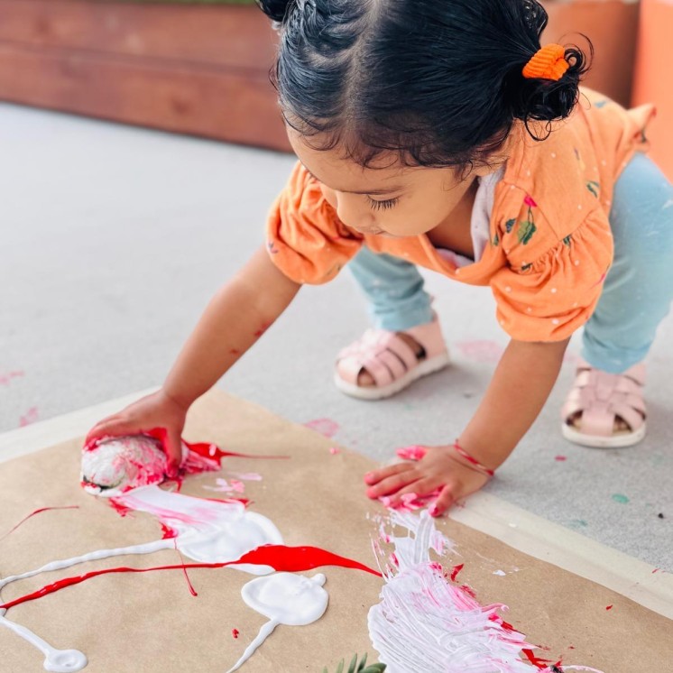 Busy Bees Te Rapa little girl outdoor painting 