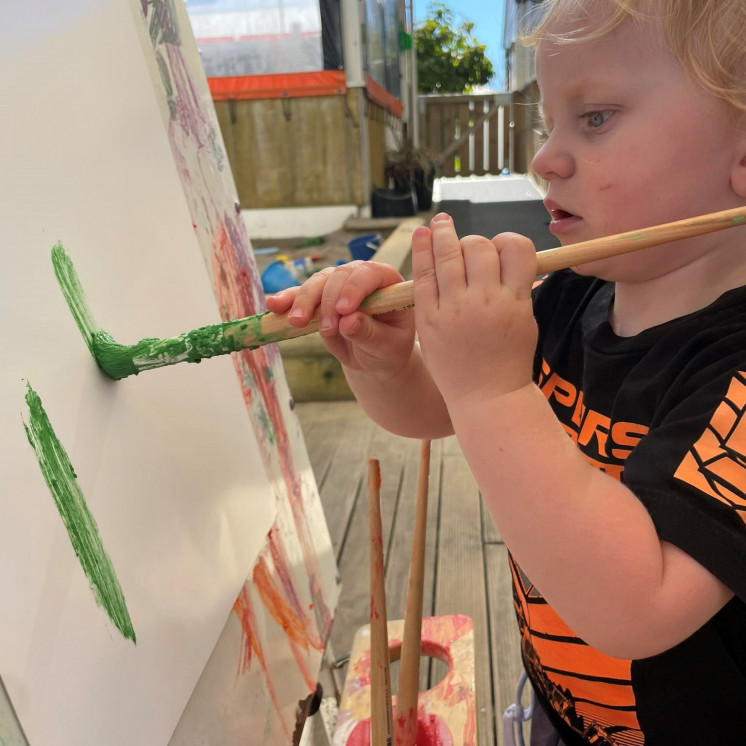 Busy Bees Wellington Street toddler getting creative with paint