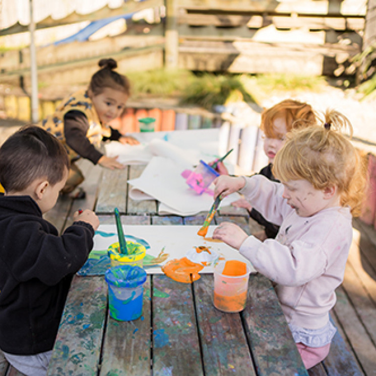 painting outside at Busy Bees Western Heights