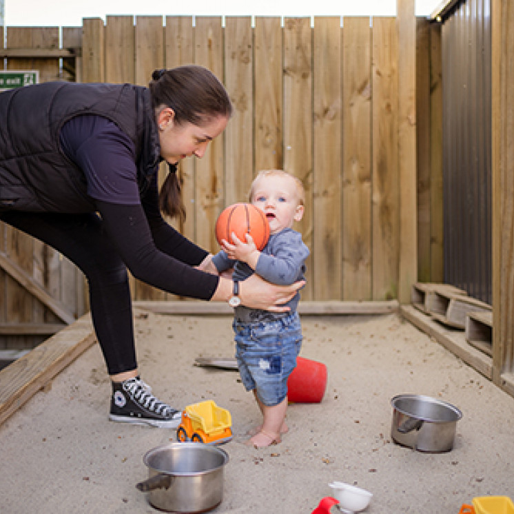Baby playing in sand pit at Busy Bees Western Heights