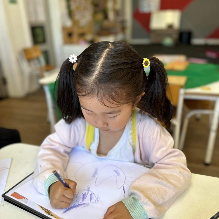 Busy Bees Westgate little girl drawing