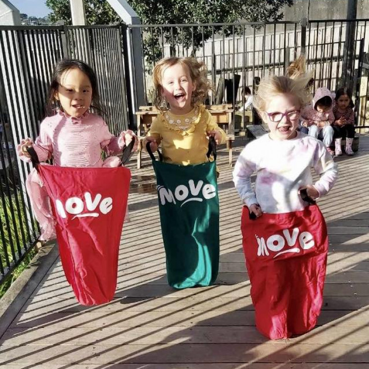 Busy Bees Westgate kids hopping around in MOVE bags