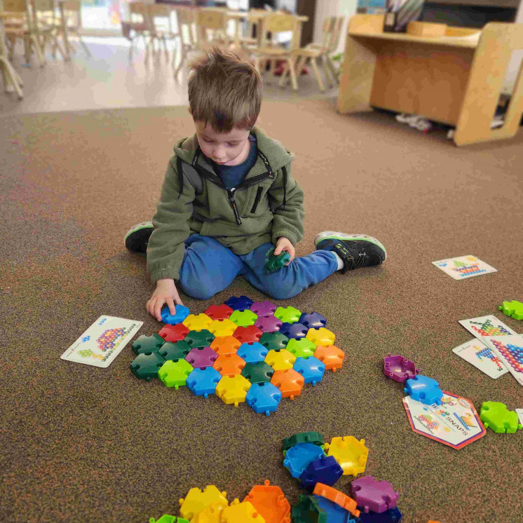 Indoor play using colourful resources in our preschool room at Busy Bees Hardy Street