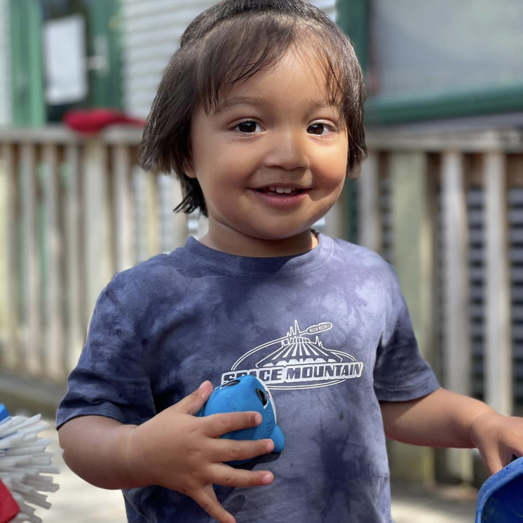 Happy toddler playing at Silverstream Early Learning by Busy bees